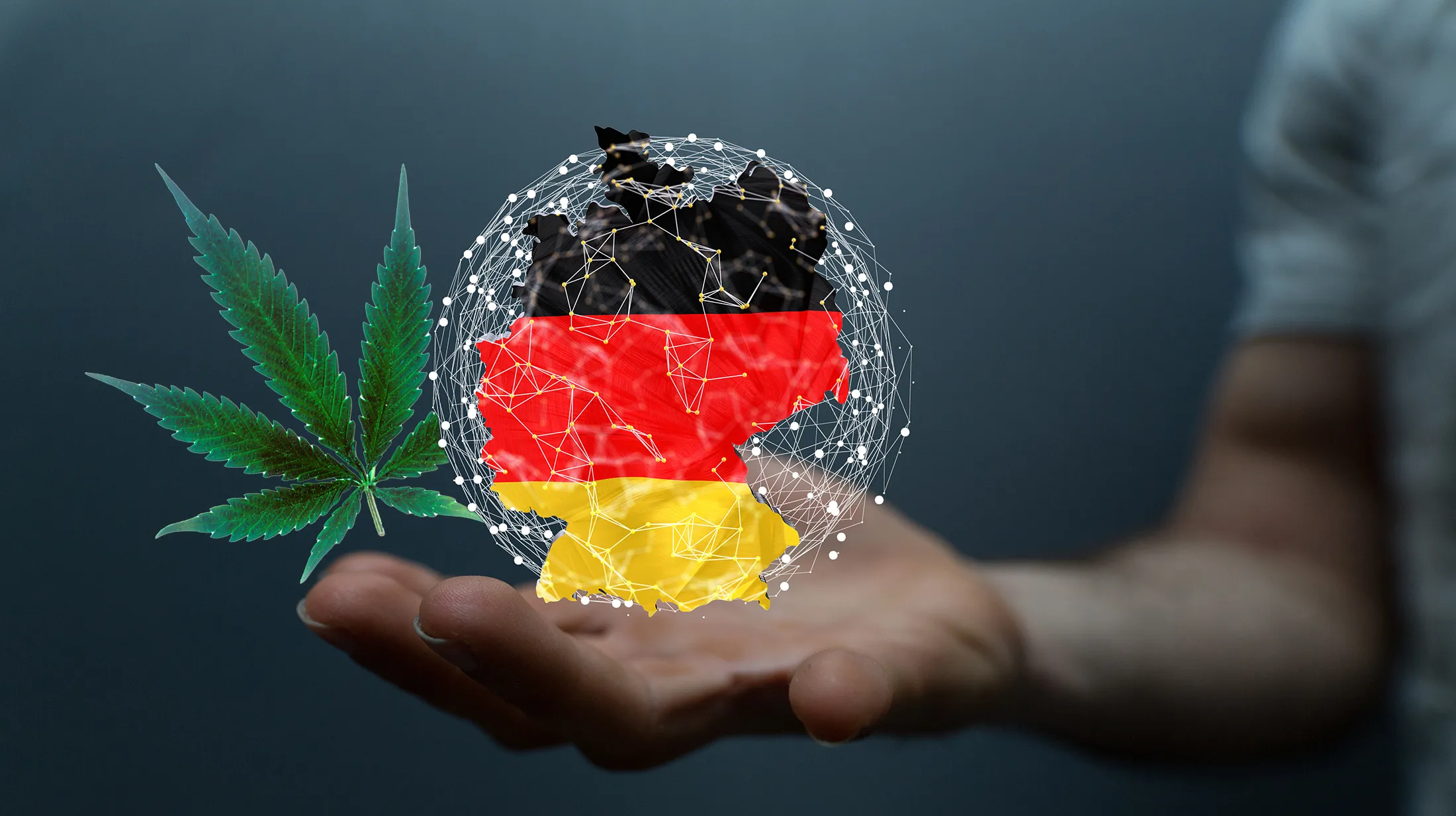 Germany legalizes cannabis hand showing German flag and cannabis leaf